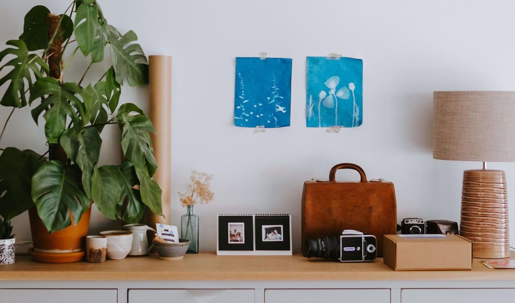 large dresser with a variety of decor on it